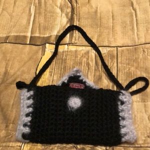 Knitted handmuff bag